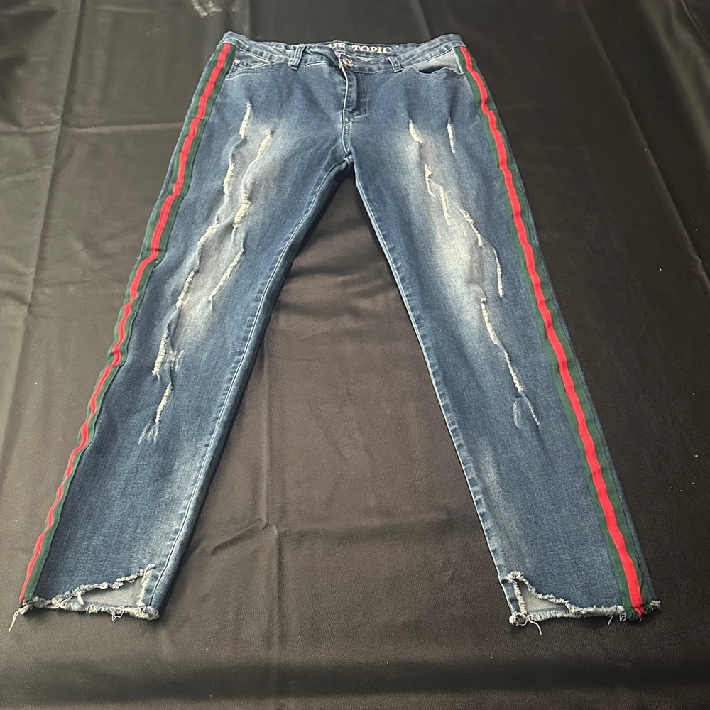 distressed blue jeans with red & green side stripes
